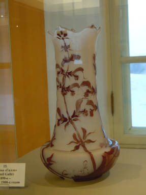Vase with wild orchids. E. Galle